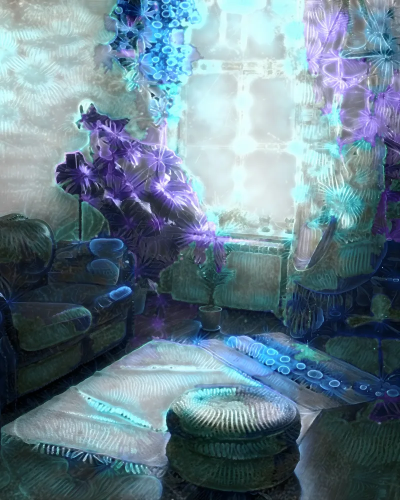 A sofa, a woven pouf and large plants by a bright window, grown